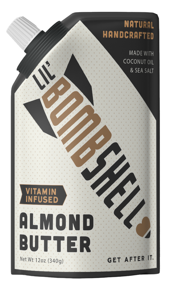 The front package of Lil' Bombshell Almond Nut Butter, which is a vitamin-infused, natural handcrafted spread with coconut oil and sea salt, presented as a slim, vertical text format on a white background.
