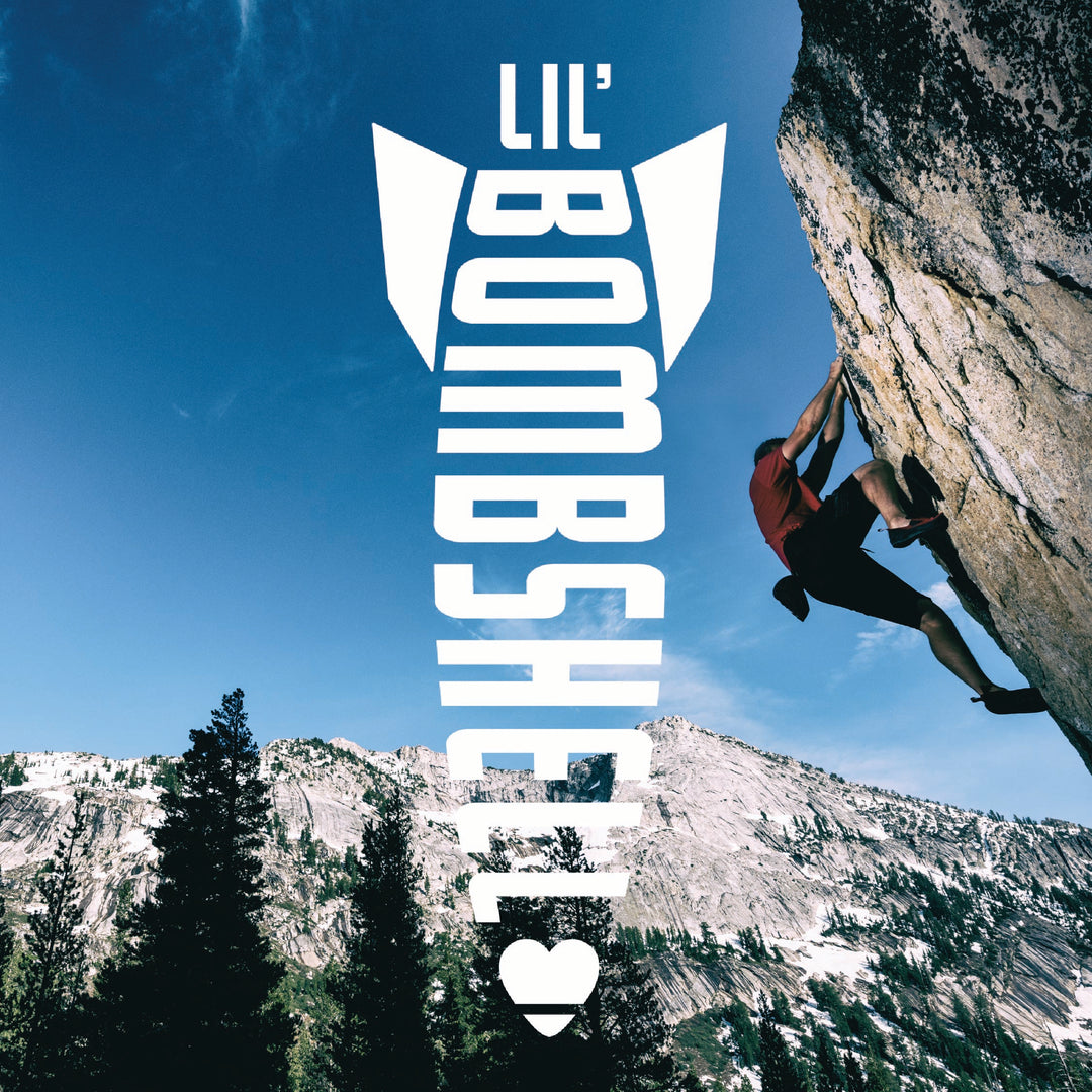 Person climbing a rocky mountain with 'Lil' Bombshell' text overlay.